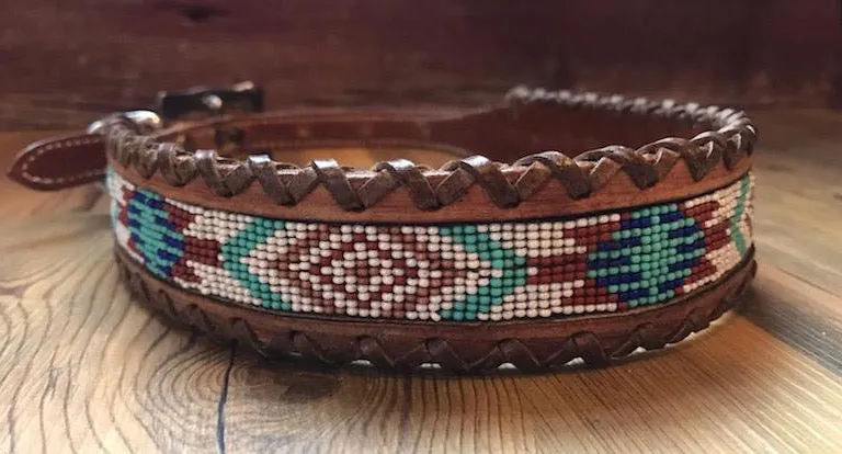 Genuine leather dog collar with white, teal, and burgundy navajo beaded inlay designa leather wrapped edge and copper hardware.